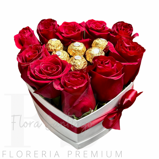 Arreglo en caja corazón con 10 rosas rojas y 6 bombones